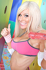 Kenzi holds a sex toy and gives a thumbs up